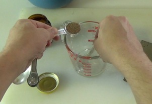 adding the yeast to the measuring cup