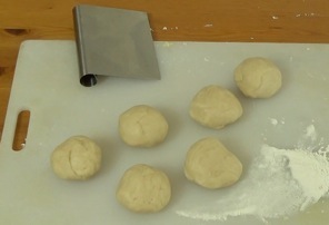 dough divided into six smaller balls