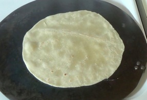 large bubbles rapidly forming on the tortilla