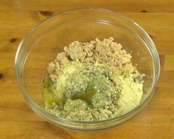 filling ingredients in a mixing bowl