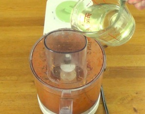 adding a small amount of oil to the food processor