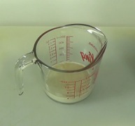 proofed yeast in measuring cup
