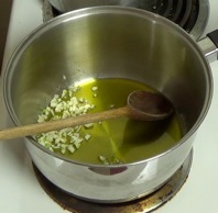 heating olive oil and garlic