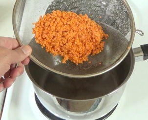 adding lentils to pot