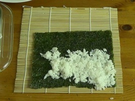 Spreading rice on the nori