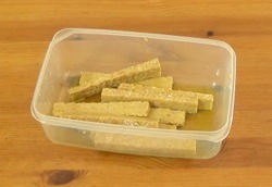 tempeh slices coated in olive oil