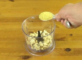 adding nutritional yeast to food processor