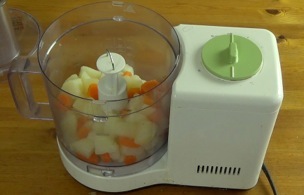 Potatoes and carrots in the food processor