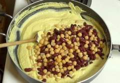 beans and chickpeas added to sauce