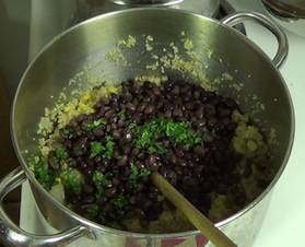 adding the black beans and cilantro