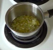 onions and garlic cooking in a small saucepan