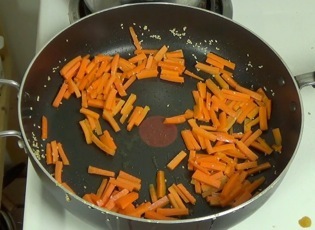 stir frying the carrots