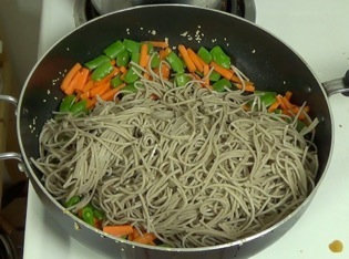 noodles added to the frying pan