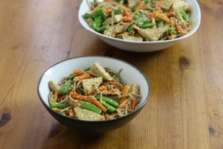 soba noodles with tofu, peas and carrots in a sesame ginger sauce