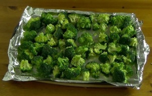 broccoli florets on aluminum foil