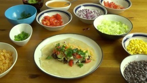 adding veggies to the burrito