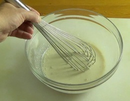 whisking together the dough ingredients