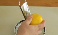 using a microplane grater for zesting a lemon